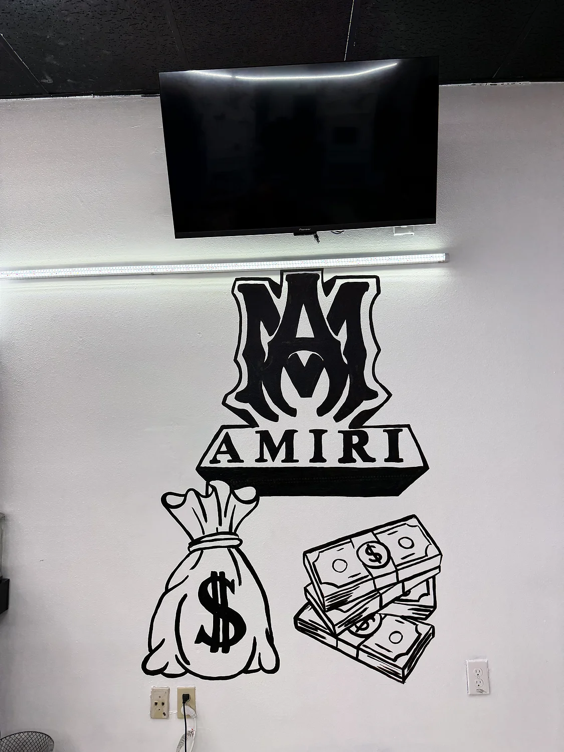 Gold barber chairs and the money-wall mural
